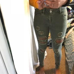 green ripped jeans